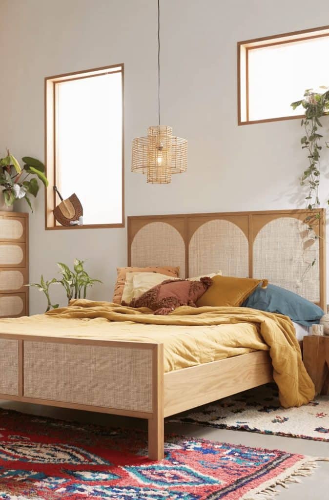 There are several ways you can incorporate light wood tones throughout your modern boho bedroom - from hardwood flooring to a light wood bed frame. 