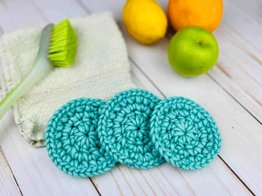 round teal colored scrubbies on counter