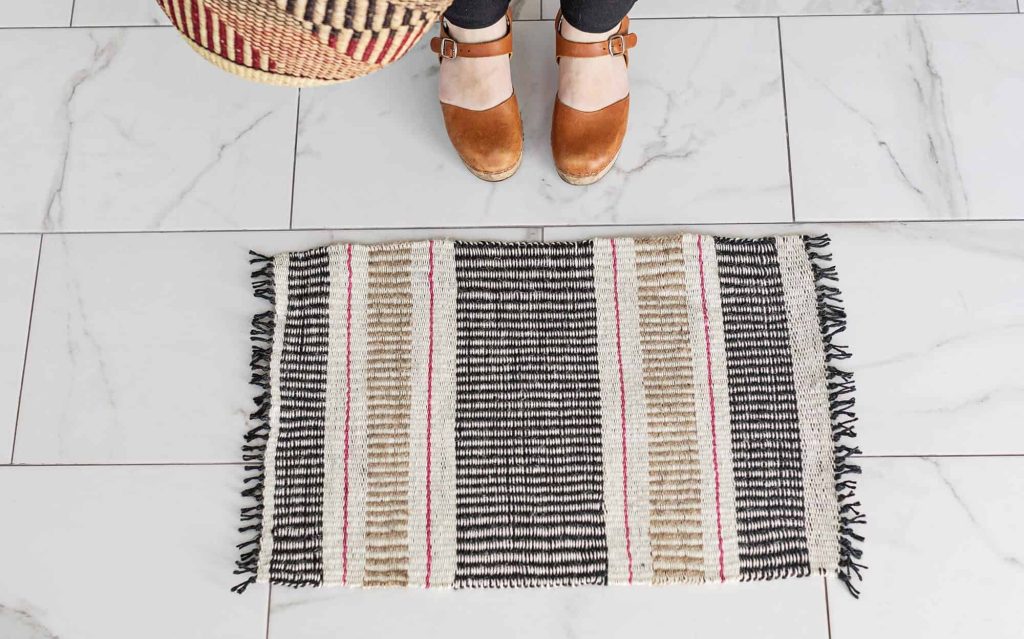 woven jute mat in tan and black
