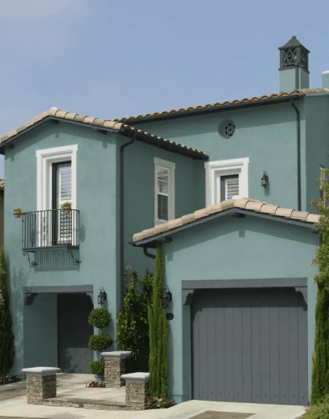 Exterior of house painted with In the Moment Behr paint color and dark trim color