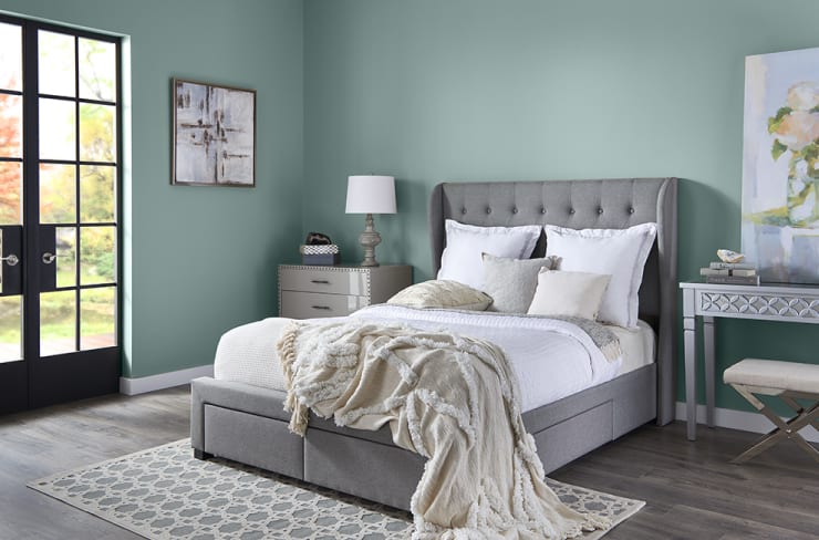 In the Moment Behr paint color on the walls in a coastal style bedroom.