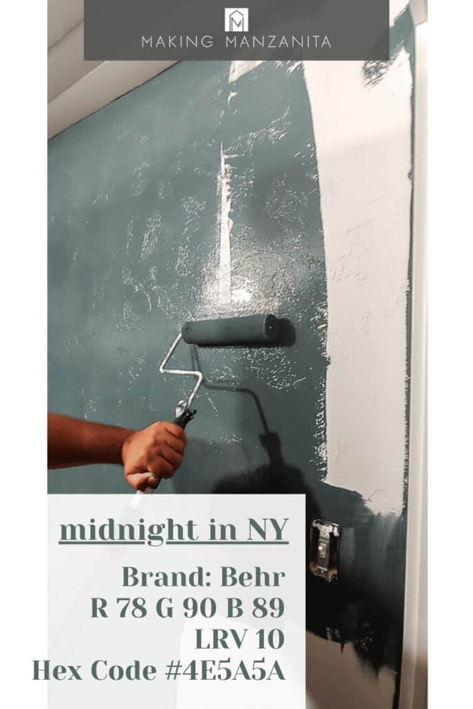 Painting the wall with a paint roller using BEHR Midnight in NY with text overlay of stats: 
Behr Paint Code: N440-7
RGB: 78 90 89
LRV: 10
Hex Code: #4E5A5A