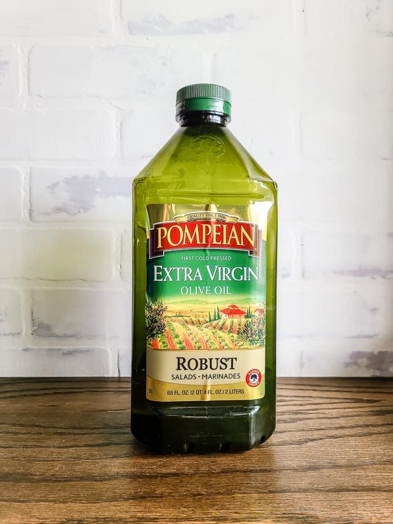 Bottle of Pompeian extra virgin olive oil sitting on wood counter top