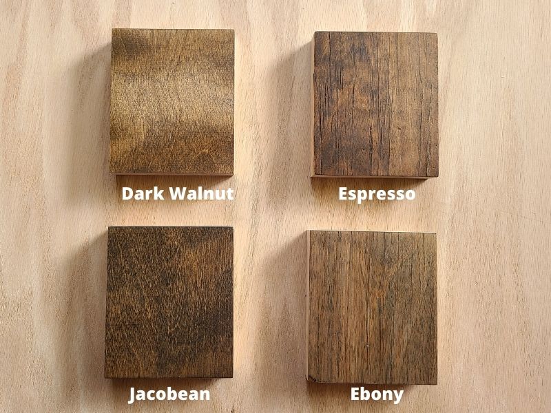 Four squares of wood with stain on each one labeled dark walnut, espresso, jacobean, and ebony