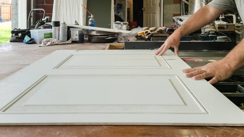 Cutting wainscoting panel using a table saw.