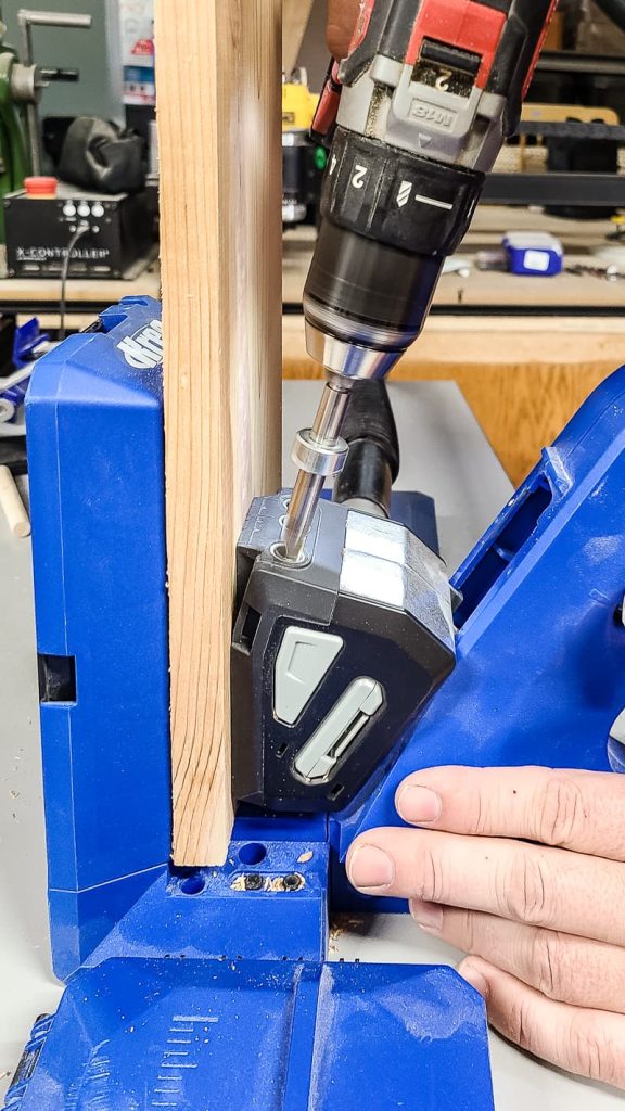 A photo of drilling the pocket holes with Kreg 720 pro pocket hole jig