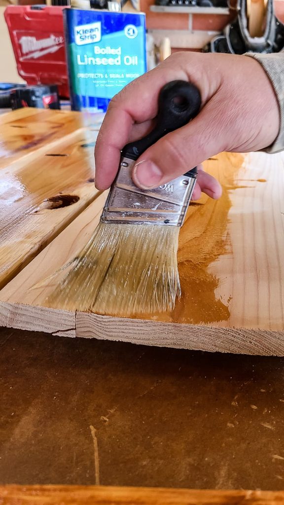 Seal the cedar wood using a paint brush and boiled linseed oil
