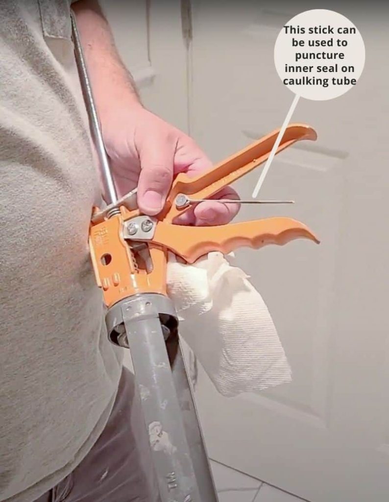 When loading a caulk gun, you can break the inner seal of the caulking tube by inserting the thin stick that’s located on the side of the caulking gun. This must be done before the caulking can be applied. The seal prevents the caulk from drying out, so be sure you are ready to rock before puncturing the seal.