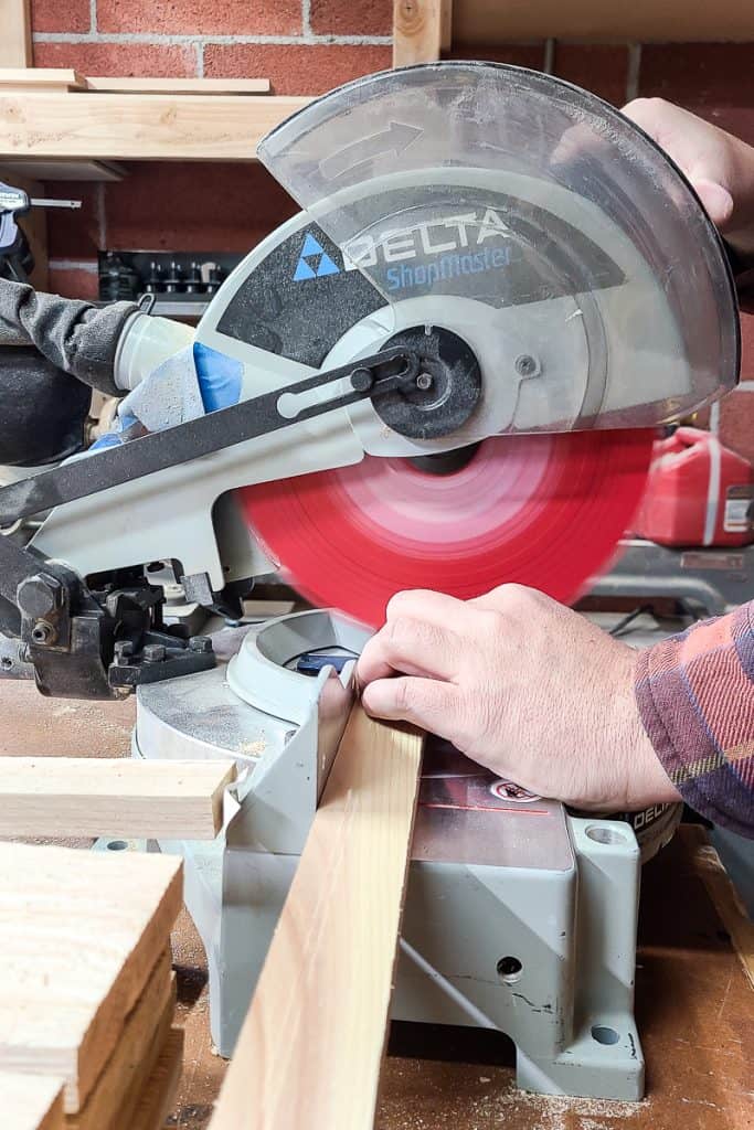 Picture of a miter saw for cutting wood to make an Outdoor Toy Deck Box.