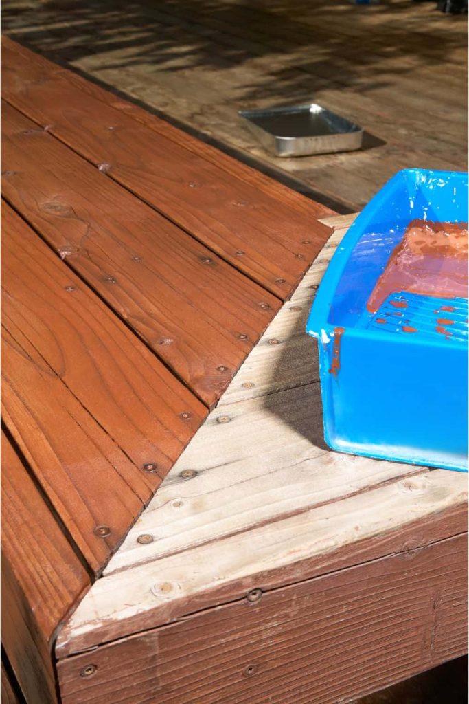 Corner of a deck with some of the boards protected with deck oil and some that haven't been yet for contrast.