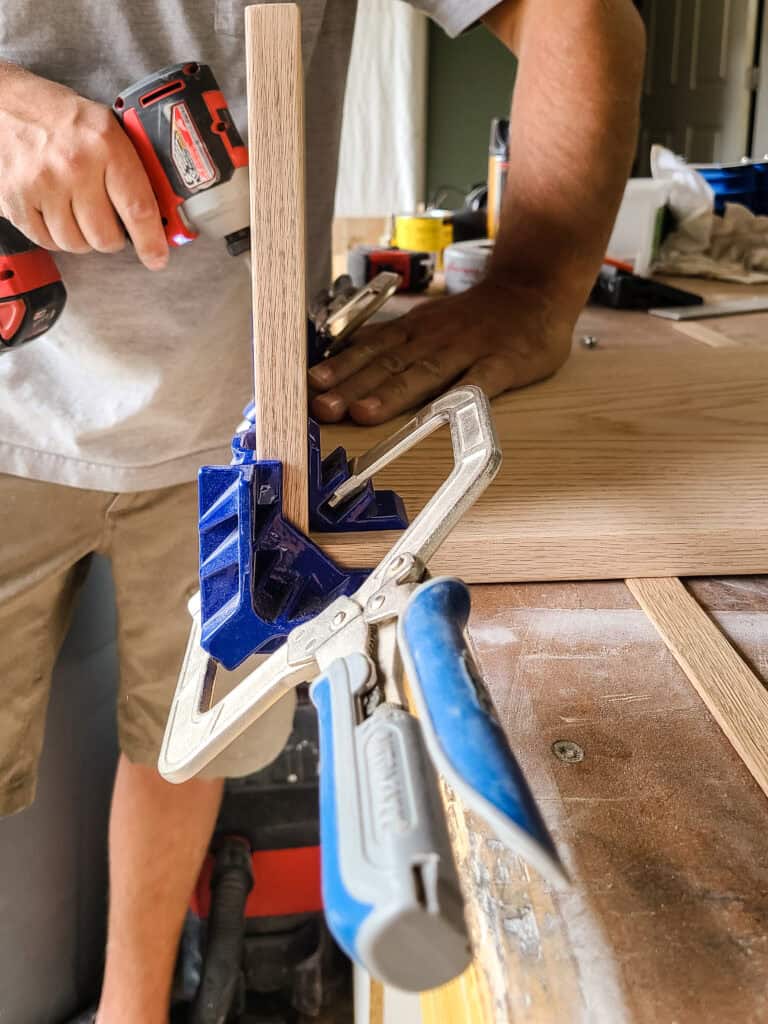 This 90-degree corner clamp works great to hold two pieces of wood together while assembling, allowing you to still use the pocket holes on the outside edge 