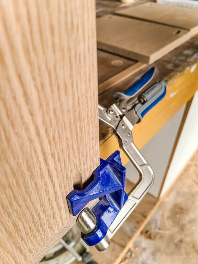 The top edge of this corner clamp allows you to still access the predrilled pocket holes on the outside edge during assembly