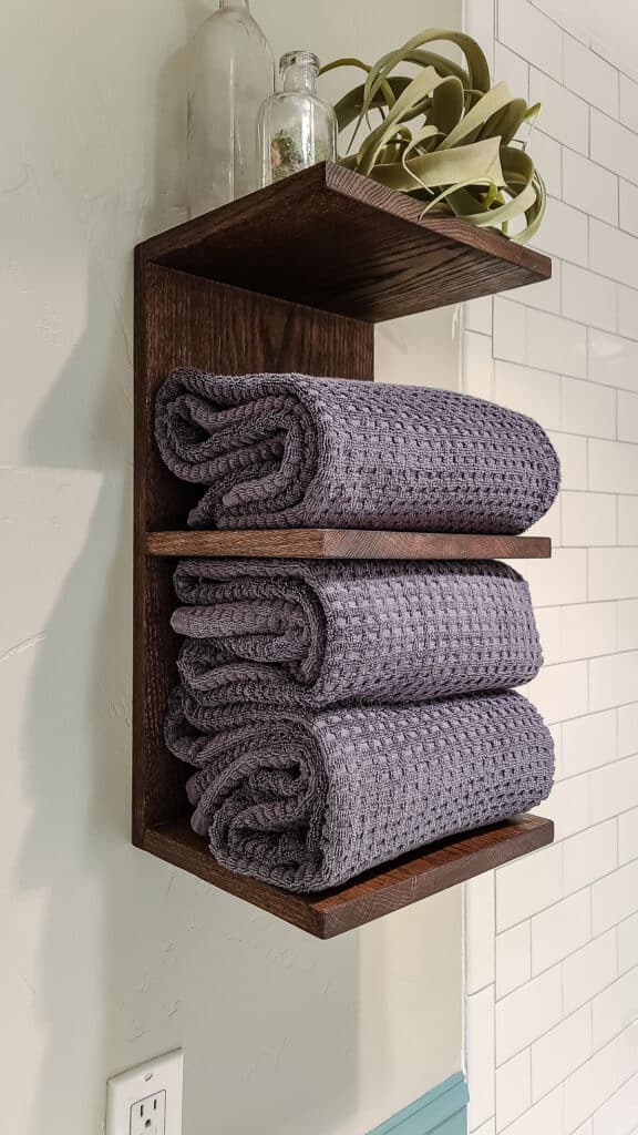 DIY towel rack in bathroom but would be great for throw blankets