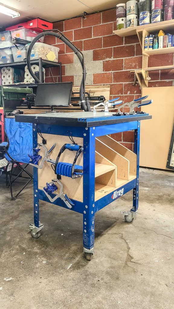 Here's how the particle board tool storage shelves turned out for the bottom of our Kreg clamp table, which is able to hold and organize our jigs and accessories. 