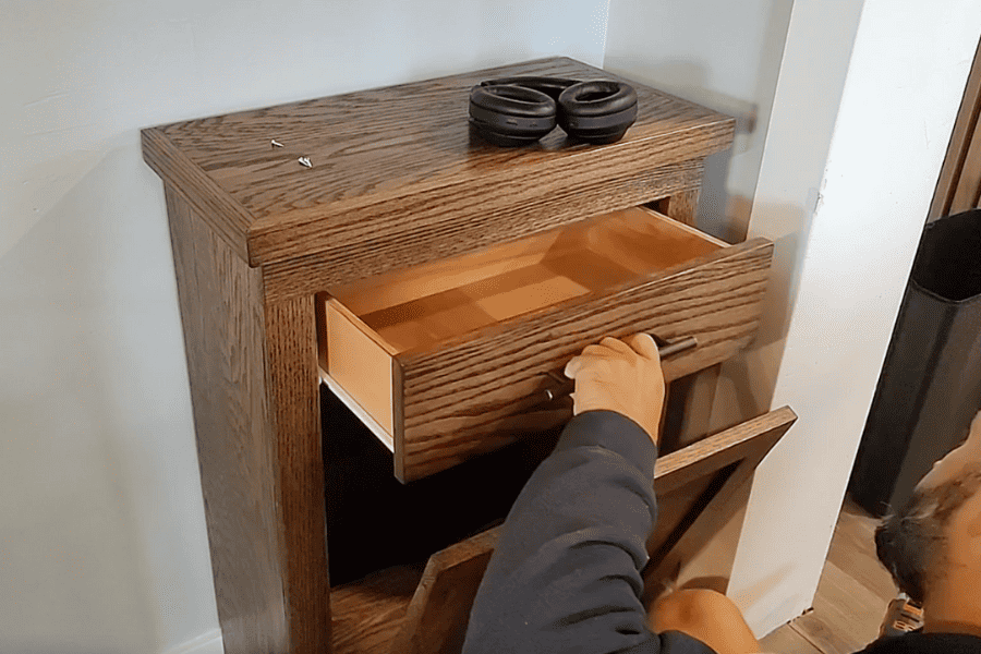 After that, the man installs the drawer slide for the diy trash cabinet, and voila! You're all done!
