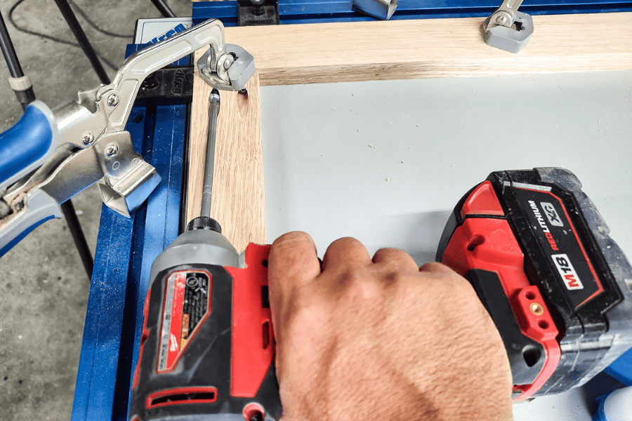 A clamp, face frame, and Kreg screws for attachment for a door with pocket hole joinery