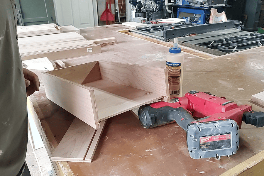 Wood pieces for drawer and glue for assembly.
