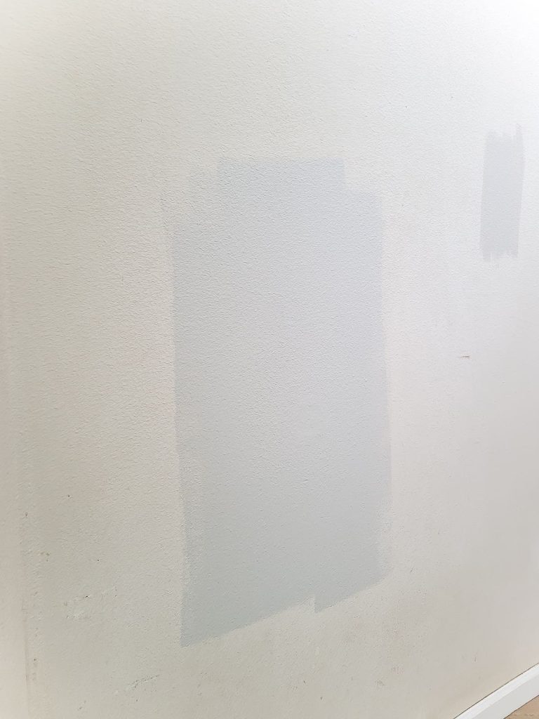 Always test your paint colors on the wall before you make a test. Here's what a swatch of BEHR mineral looks like painted on a wall.
