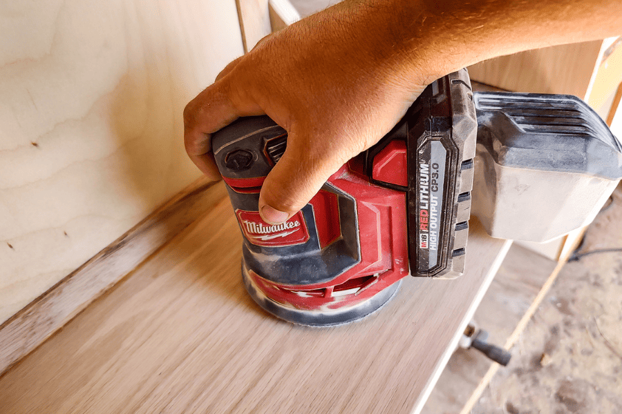 Sand down the wood using orbital sander.