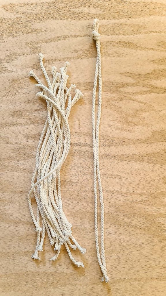 Base string for macrame feathers and strings cut to make the feather shape