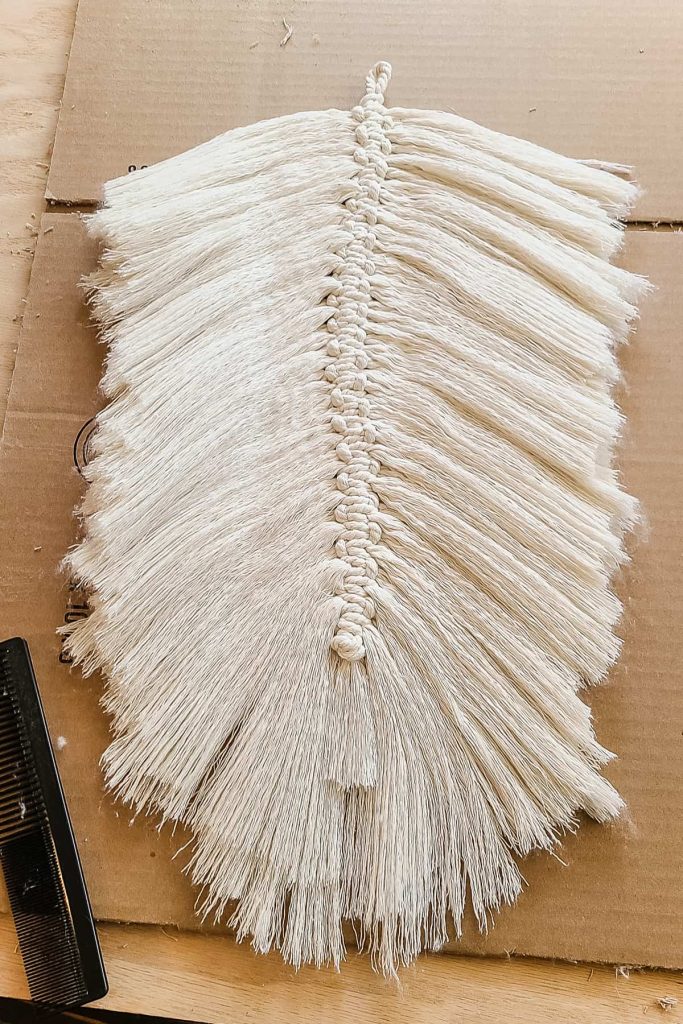 Both side of cord combed out to make a macrame feather.
