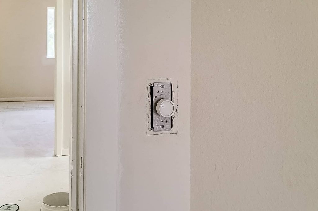 Light switch with the cover taken off for painting.