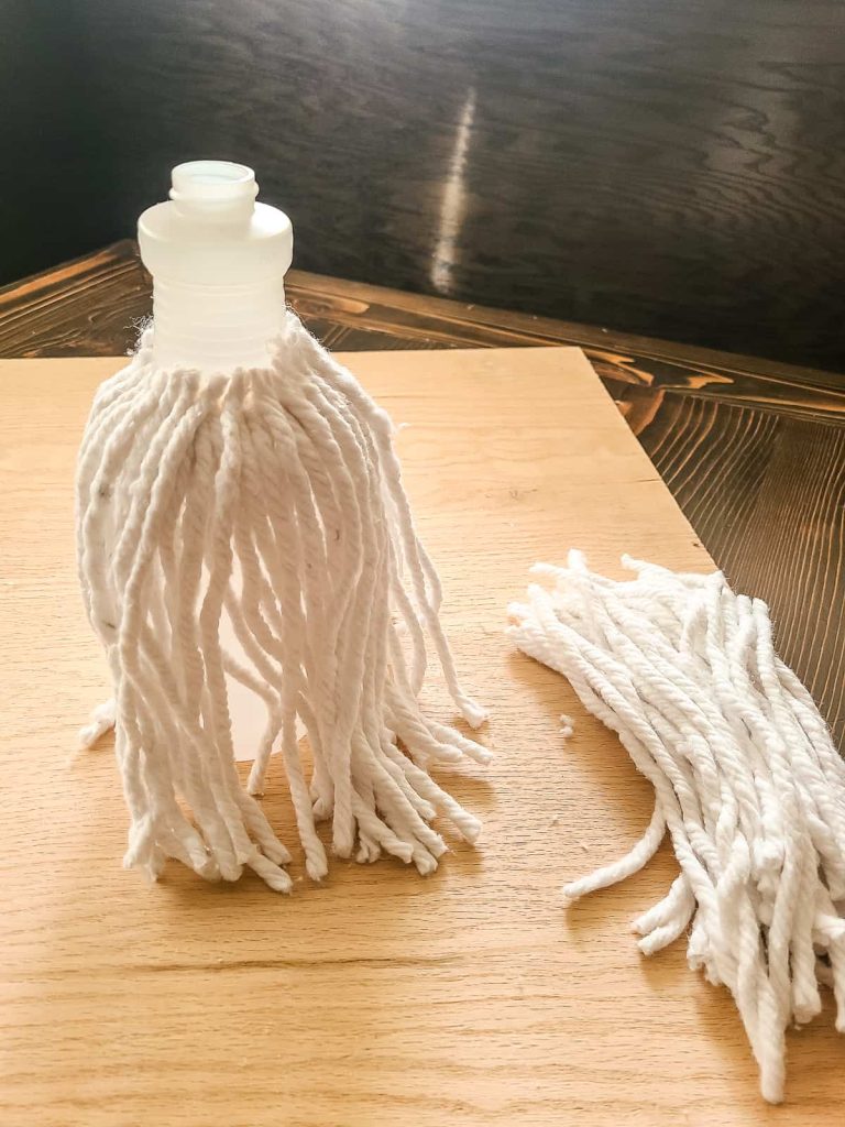 glueing mop strings on to spray bottle for the white gnome beard