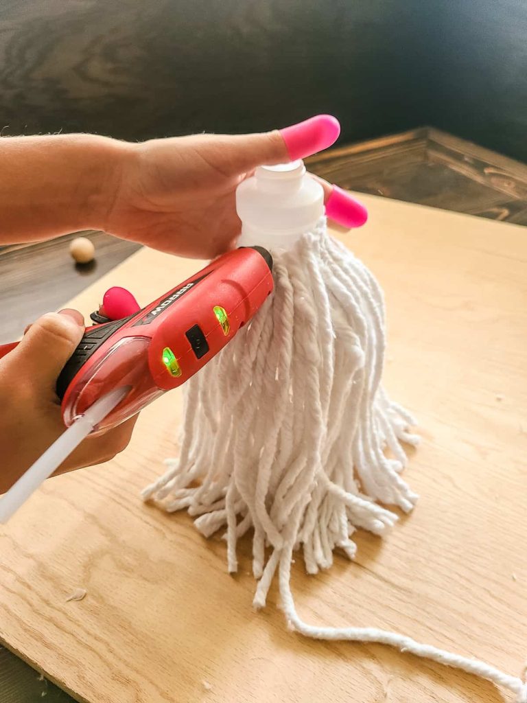 glueing mop strings to container