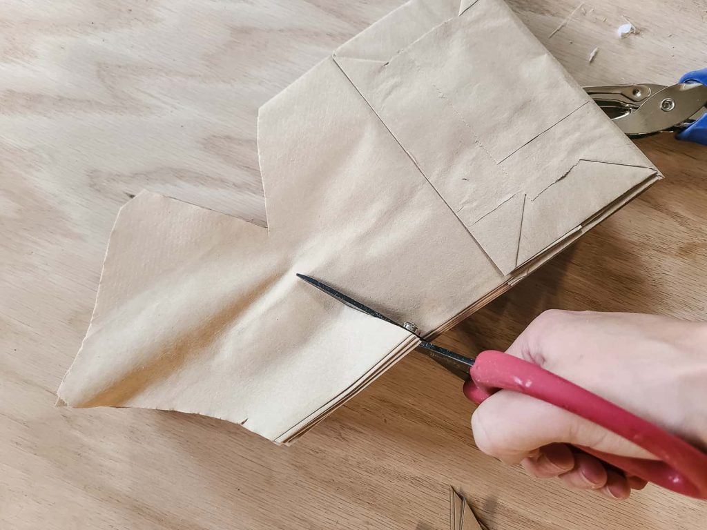 You can make every paper bag snowflake unique by making cuts with scissors if different patterns