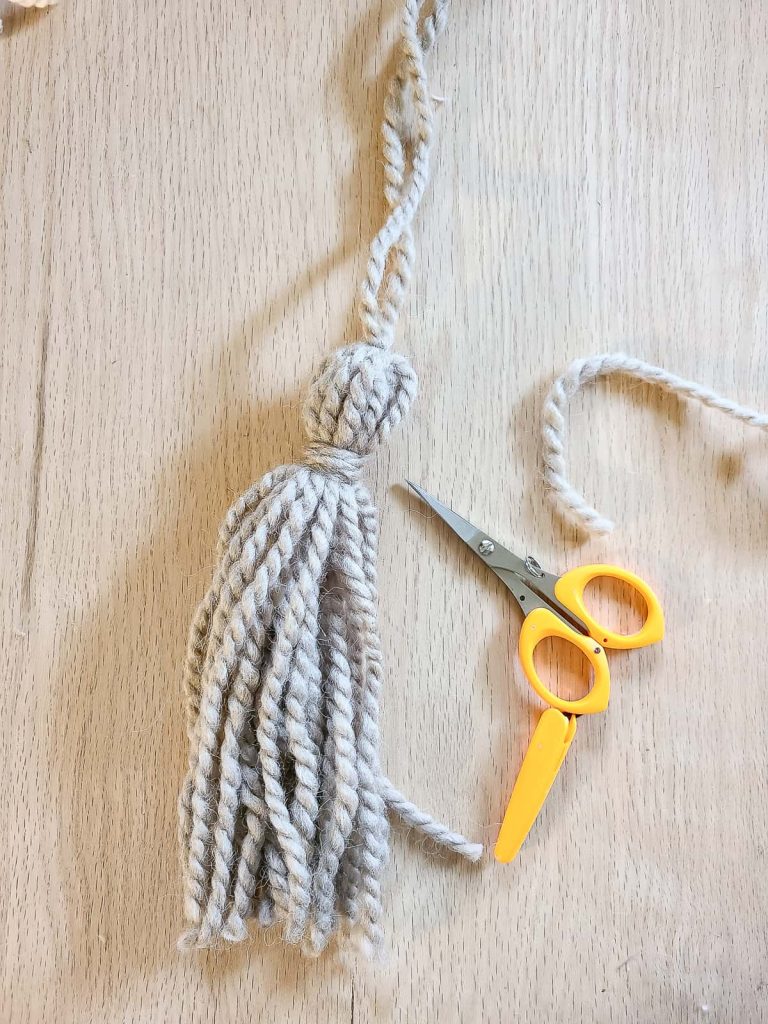 trimming strands of yarn for tassel