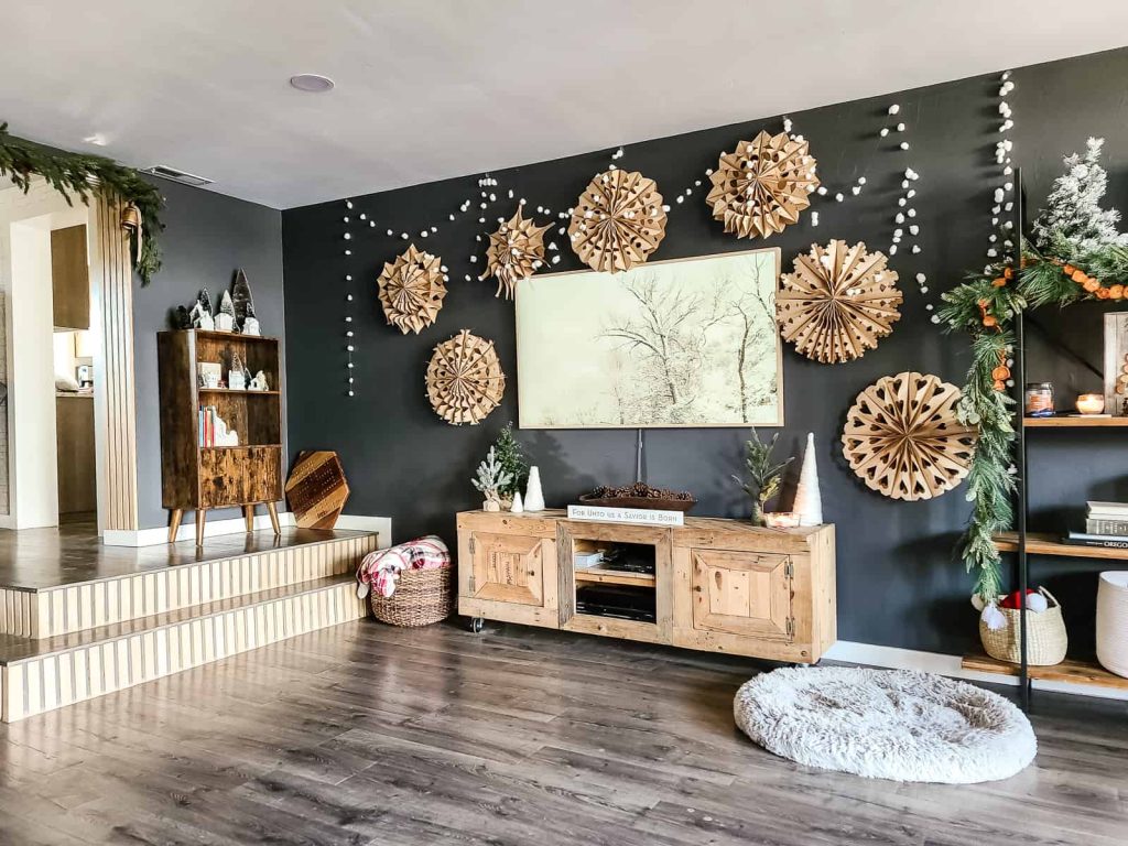 Making a display with paper bag snowflakes is a fun cheap DIY that adds a lot of Christmas flare to any room