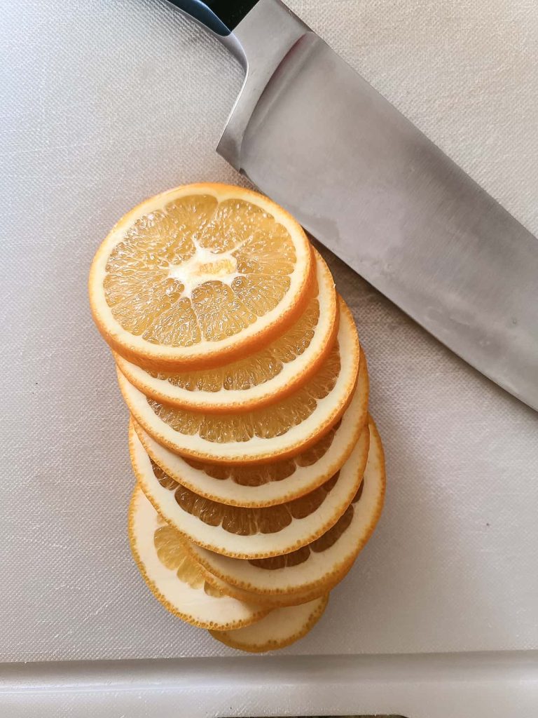 Sliced oranges are a major part of this stovetop potpourri gift that can be done with a knife or other slicing tool in the kitchen