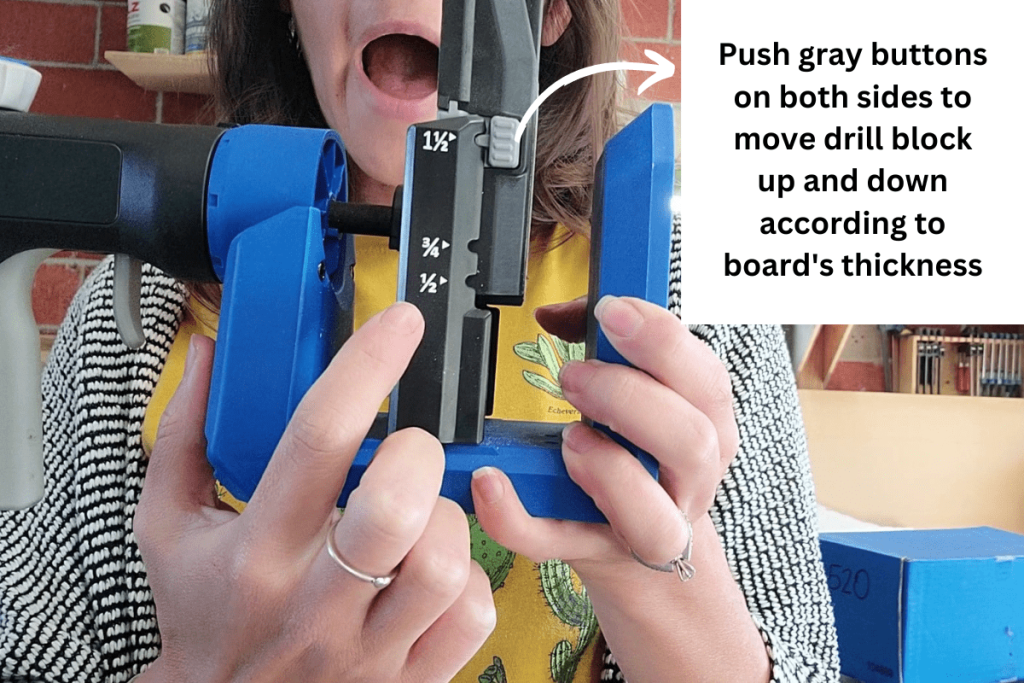 The gray buttons on both sides of the drill block on the Kreg 520 Pro allow the drill block to move up and down according to the board's thickness
