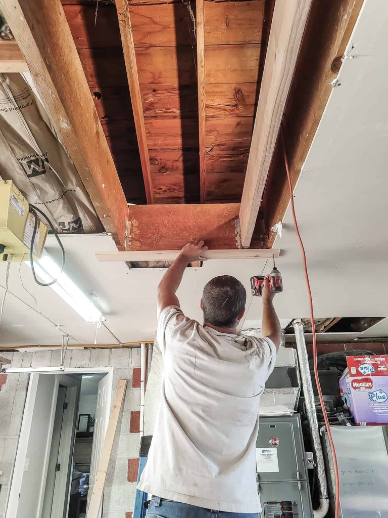 In order to rest the attic ladder up in the ceiling support boards will have to be installed to the joists