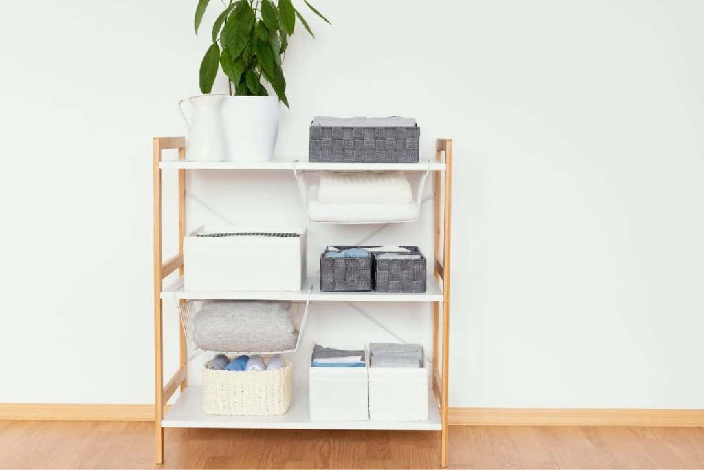 Using bins and baskets to hide visual clutter is a great solution for tiny bedrooms