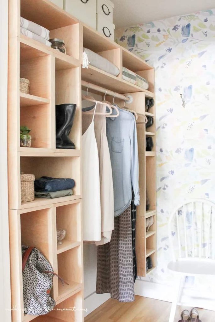 custom closet with blankets stored on top shelves