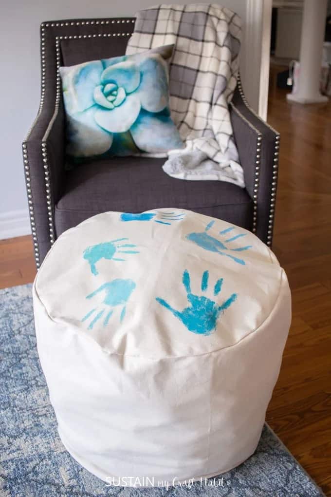 DIY canvas pouf used for blanket storage