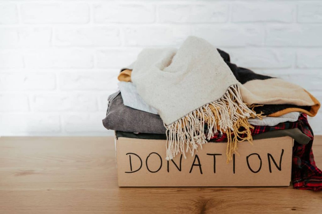 Set up a place to always put your donations so you can declutter your bedroom clothes on the regular 