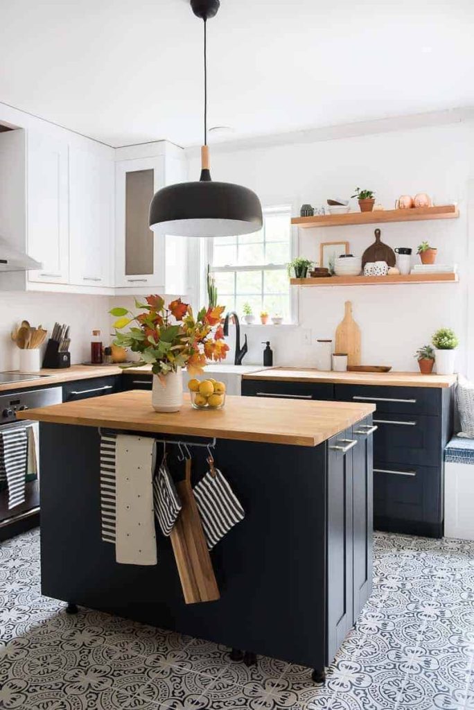 black painted kitchen island with butcher block countertop 