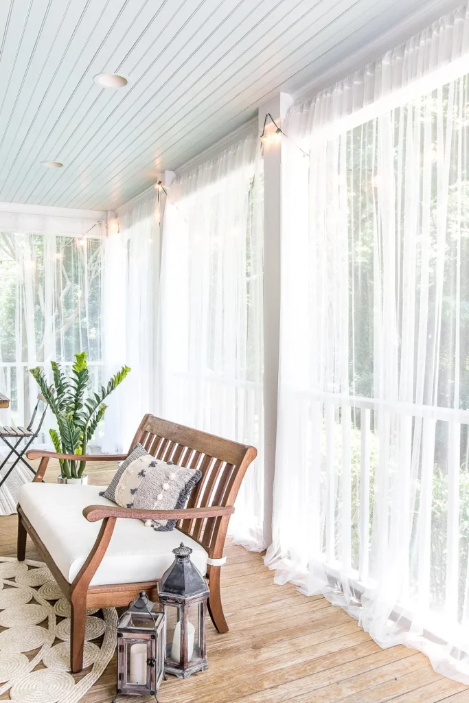 Soften the look and feel of your backyard deck by hanging sheer curtains. Once closed, it will look like a screened in porch and will help keep the bugs out