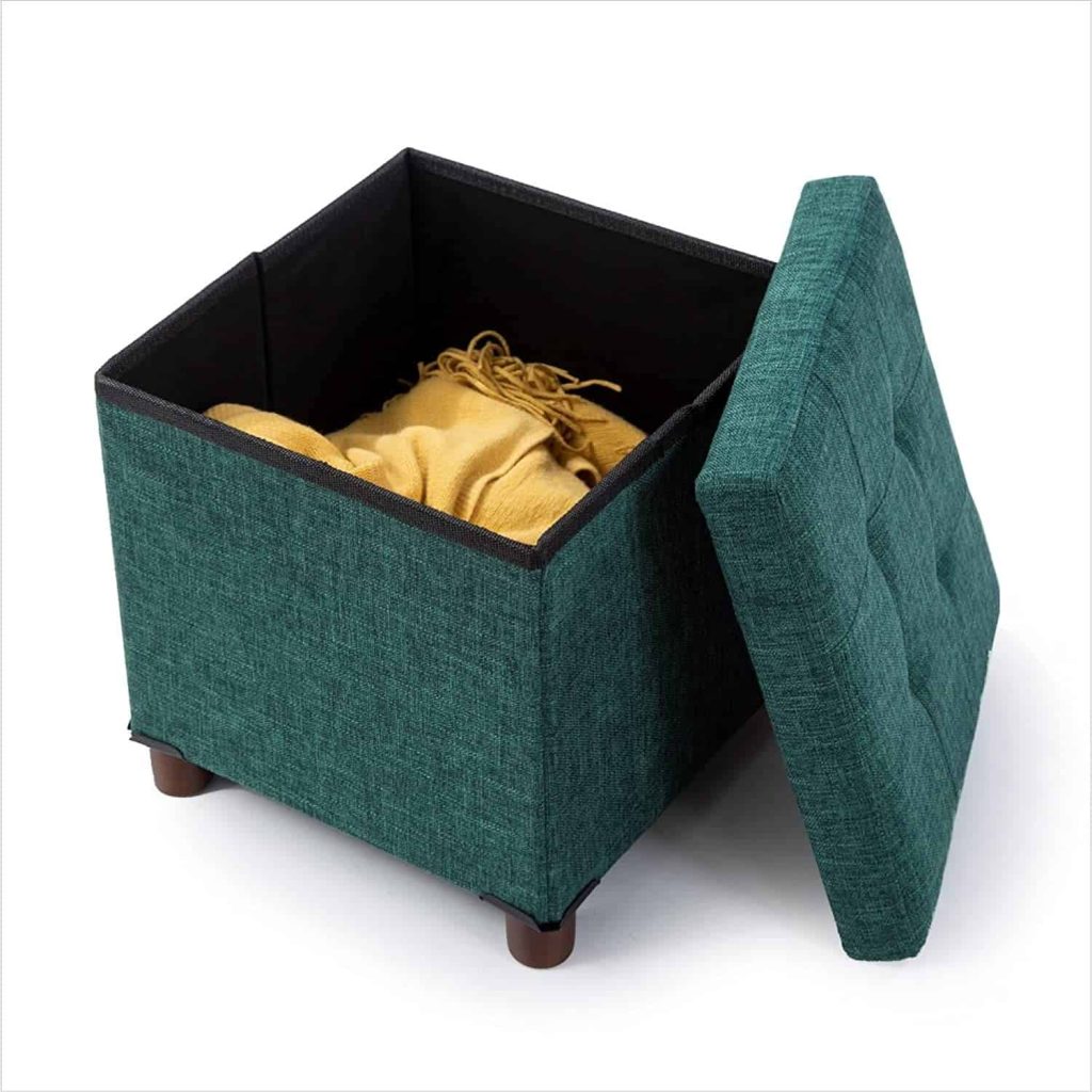 storage ottoman cube with the top off and blankets inside