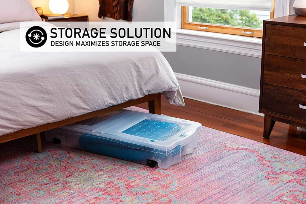 Utilize the space under your bed with plastic storage bins on wheels to maximize storage space in a small bedroom