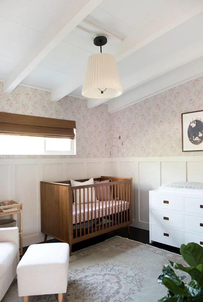 mid century nursery with burnt orange touches white dresser and other nursery color ideas