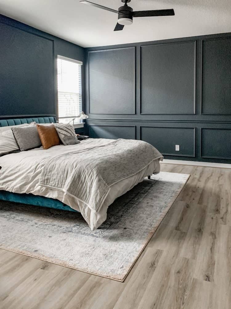 This bedroom looks so cozy painted with Behr Ink Black on all four walls