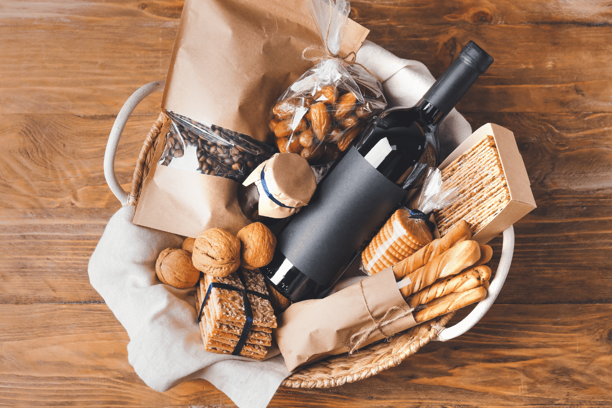 https://www.makingmanzanita.com/wp-content/uploads/2023/02/gift-basket-with-wine-crackers-coffee-beans.png