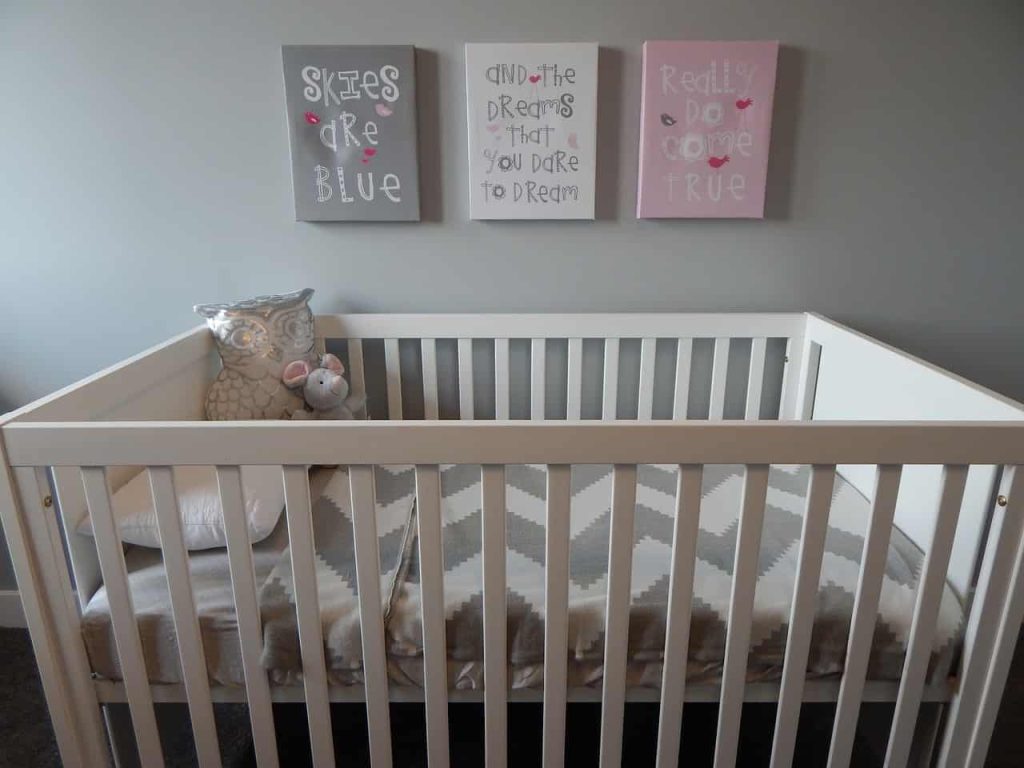 using a grey color for a nursery color idea to compliment a pink colors in a nursery 