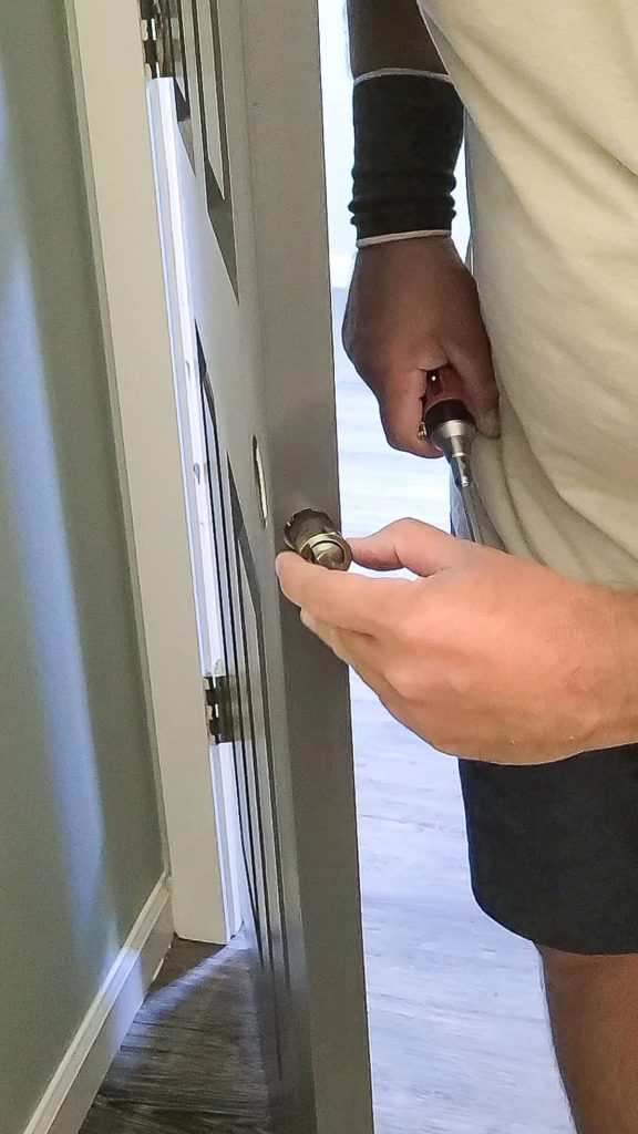 Insert the ring latch into the door with the rounded edge facing the striker plate for the interior door handle replace