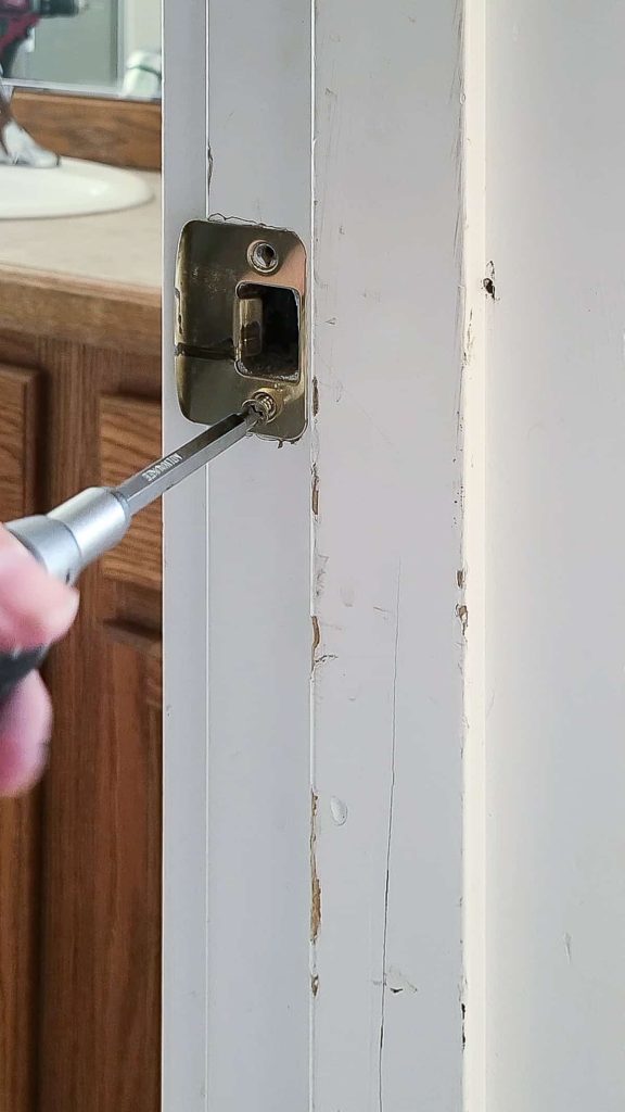 The striker plate must be removed before you replace the door handle on an interior door