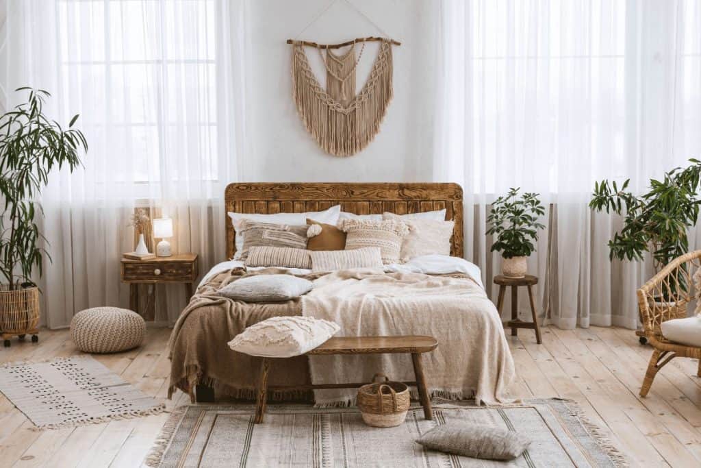 a modern boho style bedroom using a lot of natural fibers and mixing and matching 