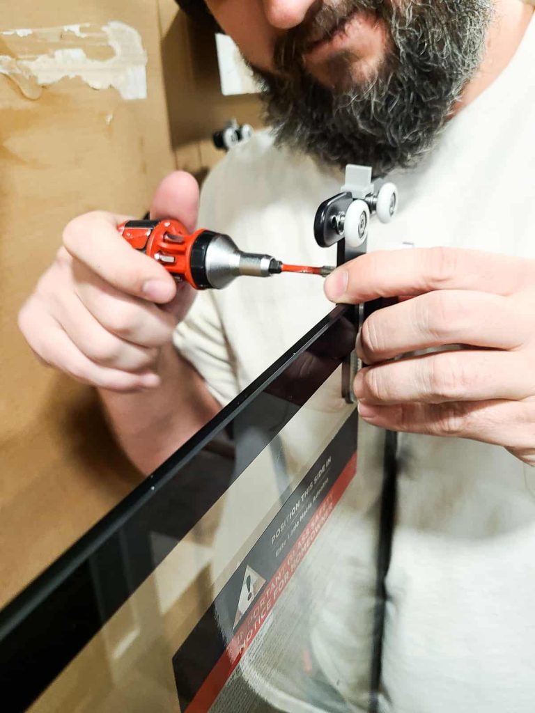 Installing rollers on a how to install shower door that is tempered glass to hang on the rail